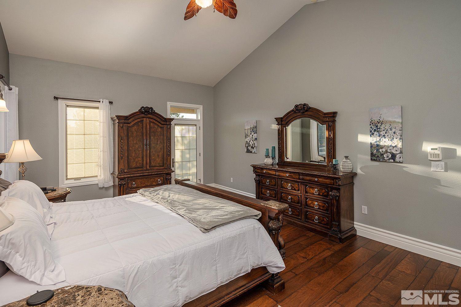 4530 Lousetown Road Reno, NV 89521 - Photo 17 of 39 a bedroom with a bed and wooden floor