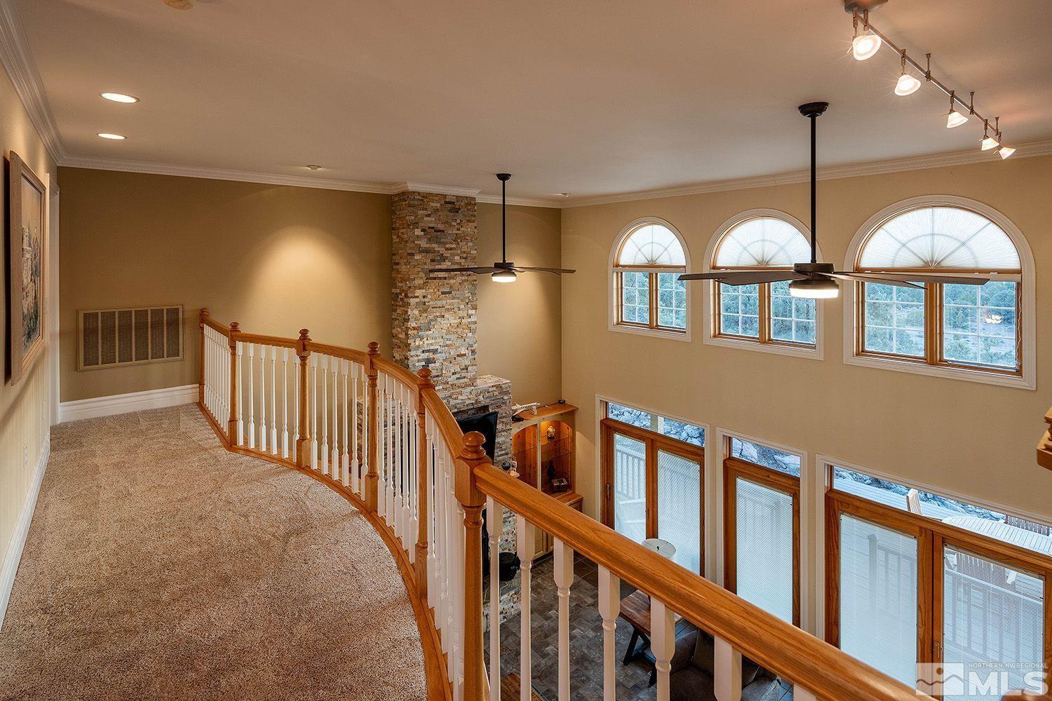 4530 Lousetown Road Reno, NV 89521 - Photo 20 of 39 a view of a living room with a large window and chandelier