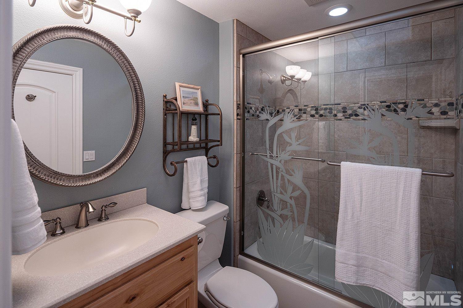4530 Lousetown Road Reno, NV 89521 - Photo 23 of 39 a bathroom with a sink a toilet and shower