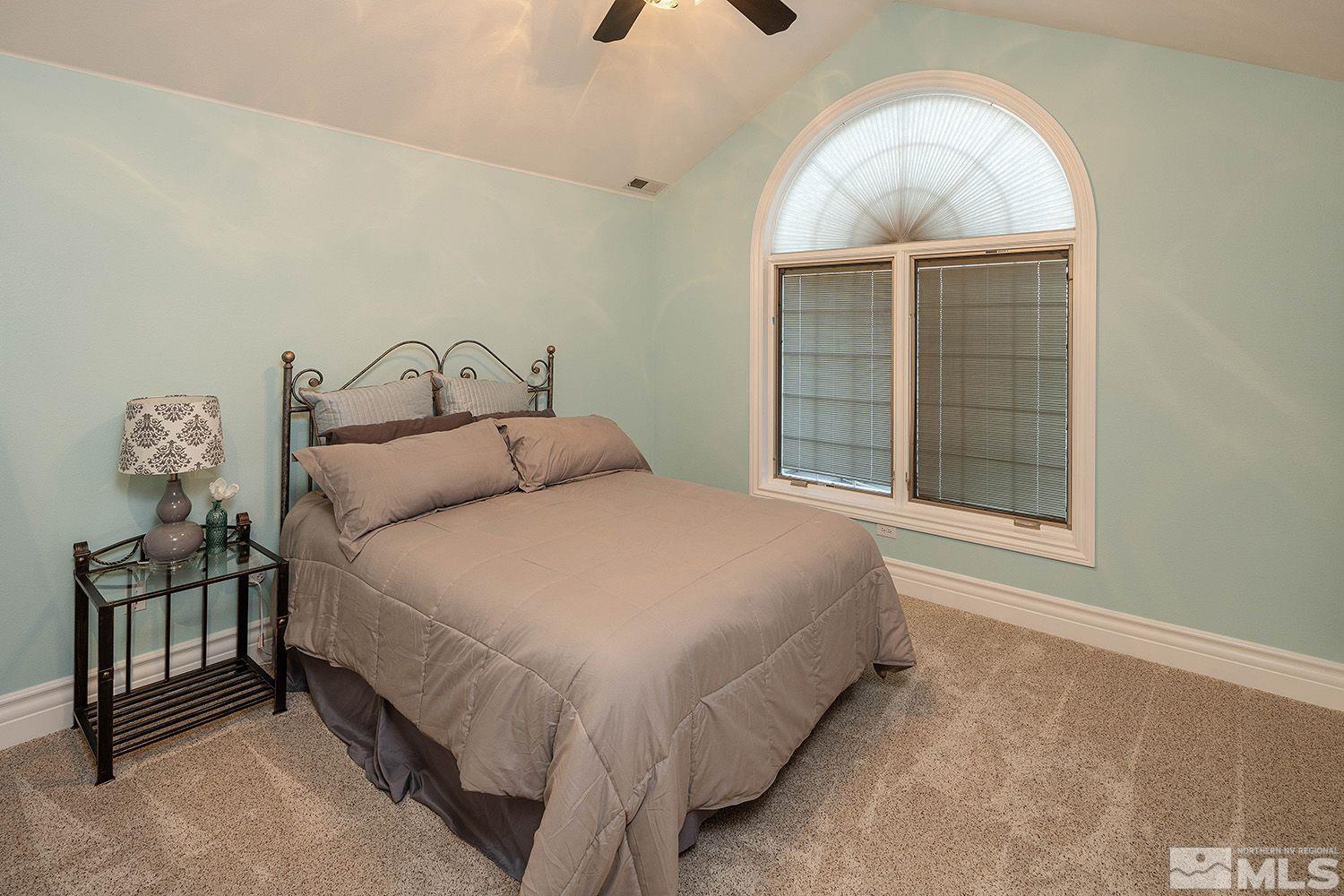 4530 Lousetown Road Reno, NV 89521 - Photo 26 of 39 a bedroom with a bed and a window