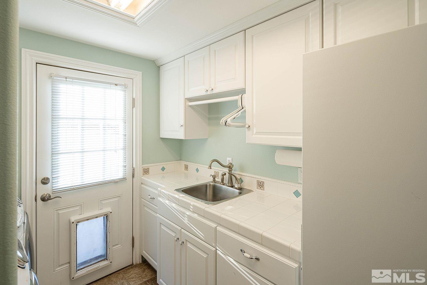 4530 Lousetown Road Reno, NV 89521 - Photo 27 of 39 a kitchen with a sink dishwasher and cabinets