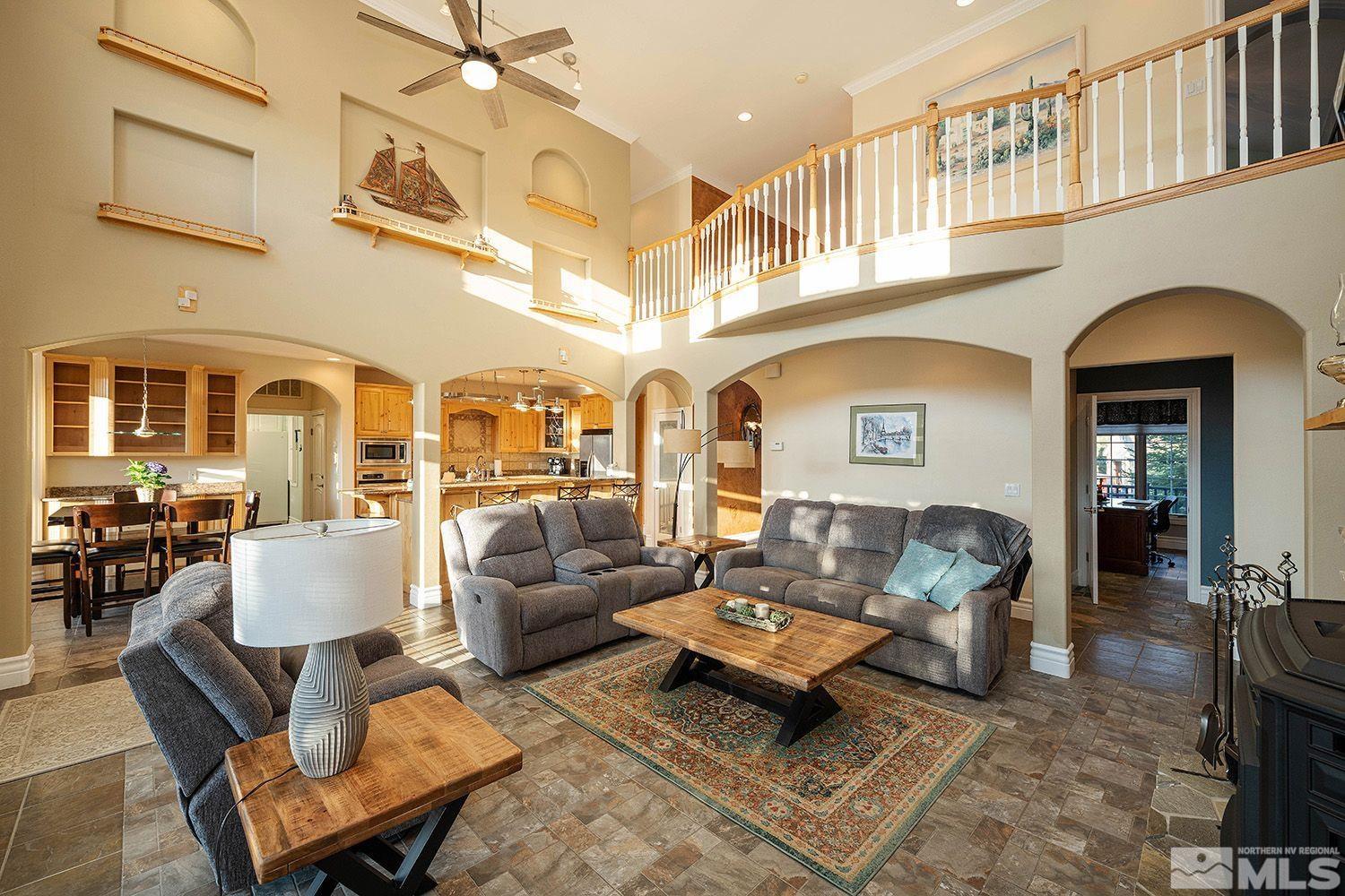 4530 Lousetown Road Reno, NV 89521 - Photo 5 of 39 a living room with furniture and a fireplace