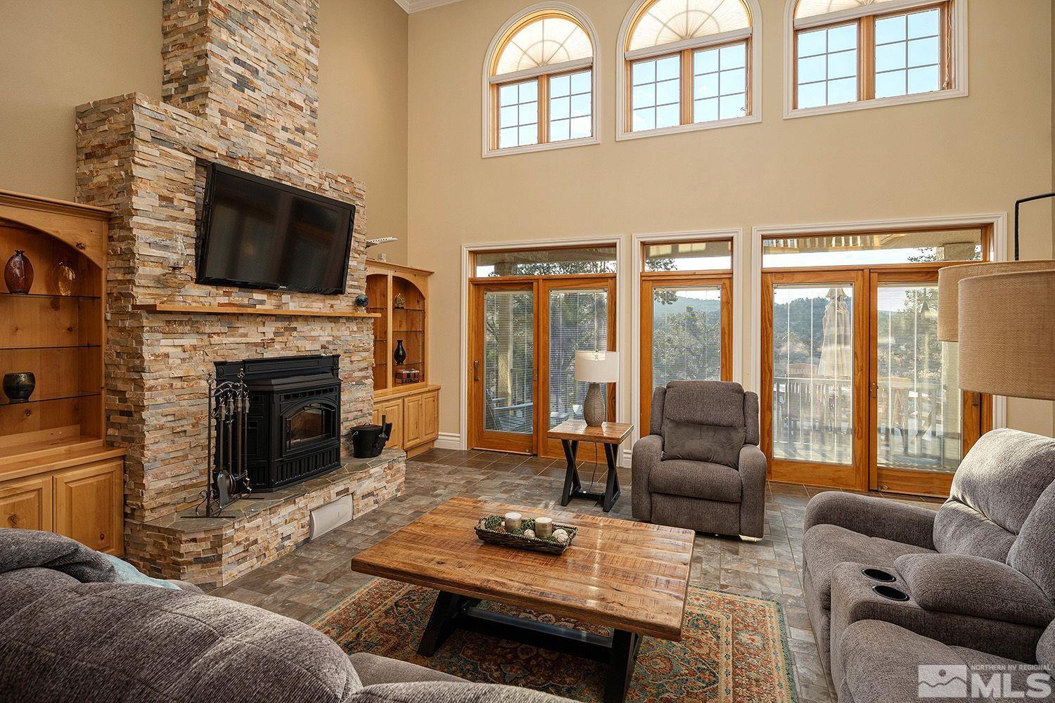 4530 Lousetown Road Reno, NV 89521 - Photo 6 of 39 a living room with furniture fireplace and flat screen tv