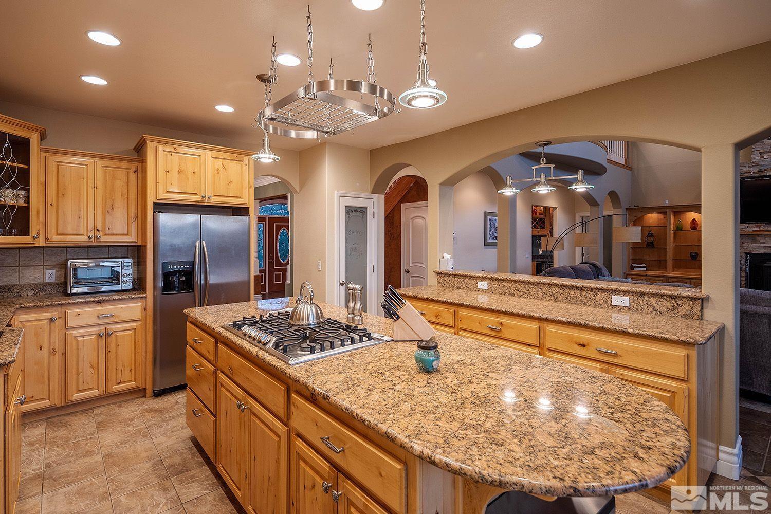 4530 Lousetown Road Reno, NV 89521 - Photo 7 of 39 a kitchen with stainless steel appliances granite countertop a sink a stove and refrigerator