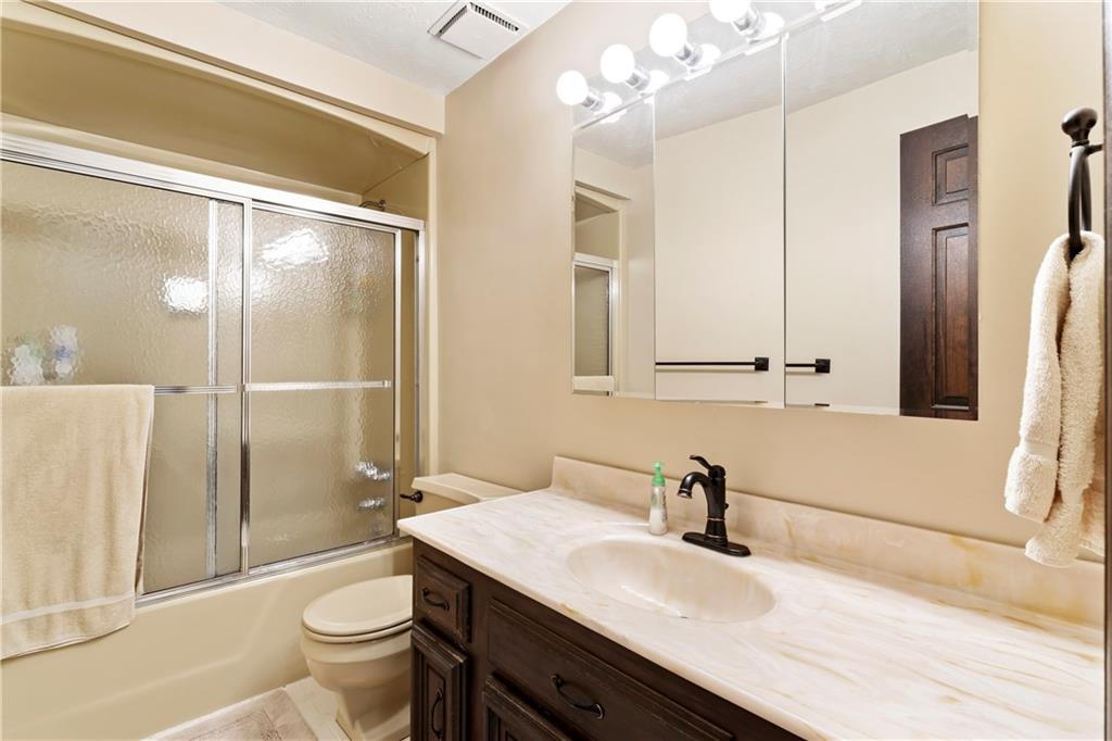 224 County Line Road Bridgeville, PA 15017 - Photo 18 of 25 a bathroom with a sink a toilet and shower