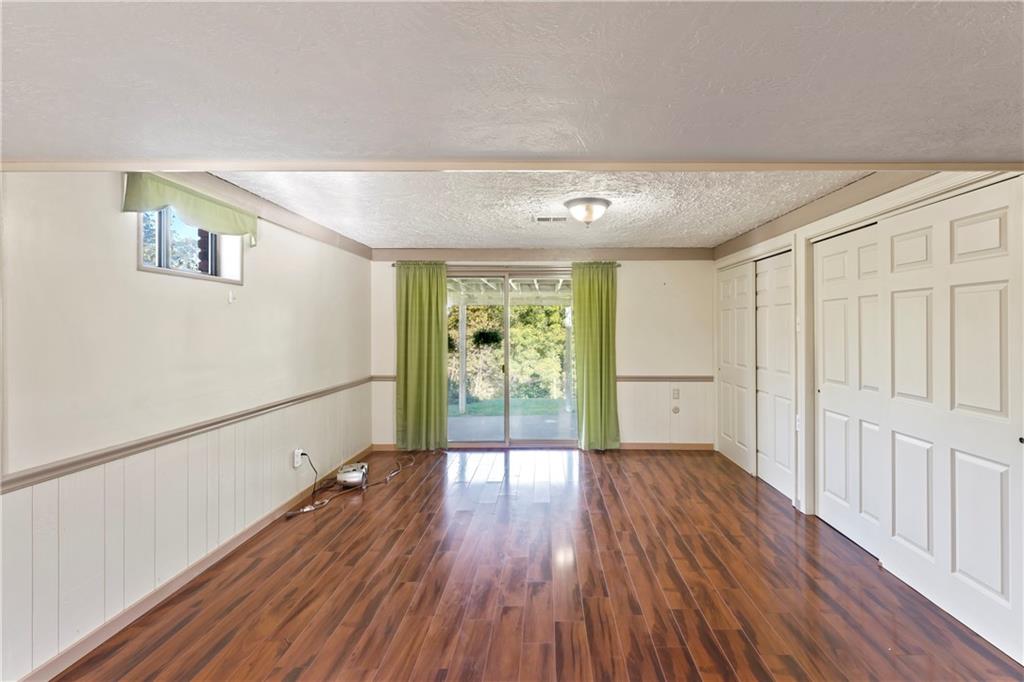 224 County Line Road Bridgeville, PA 15017 - Photo 20 of 25 a view of an empty room with wooden floor and a window