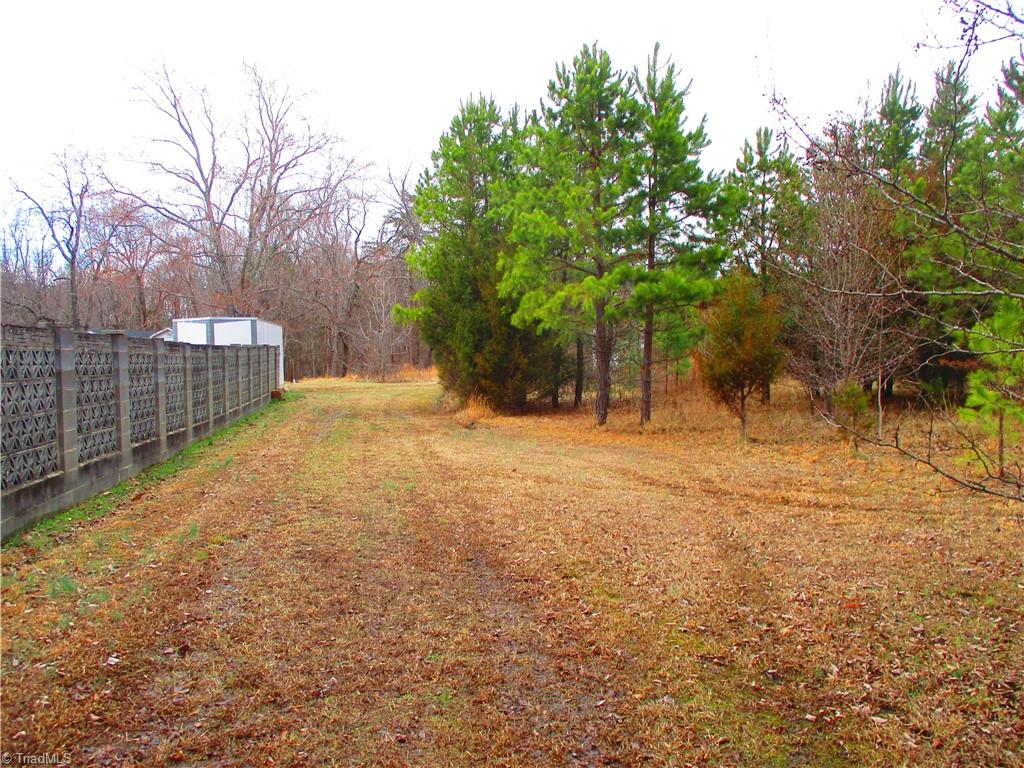 1809 Alamance Church Road Greensboro, NC 27406 - Photo 2 of 15 Asphalt drive ends and becomes a field.