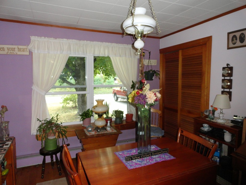 24 Warren Road Townsend, MA 01469 - Photo 5 of 15 a living room with furniture dining table and a large window