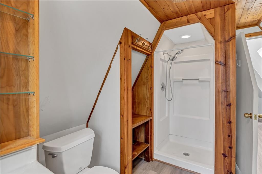 12005 A Hutchesons Ferry Road Palmetto, GA 30268 - Photo 30 of 53 a bathroom with a toilet and a shower