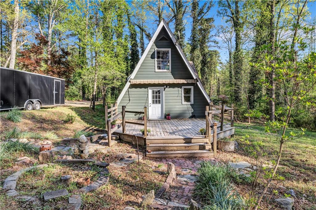 12005 A Hutchesons Ferry Road Palmetto, GA 30268 - Photo 3 of 53 a backyard of a house with table and chairs