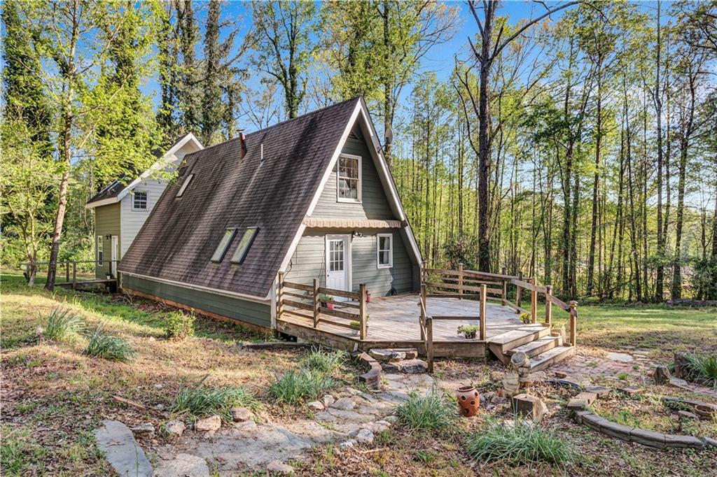 12005 A Hutchesons Ferry Road Palmetto, GA 30268 - Photo 36 of 53 a view of backyard with wooden fence and a bench