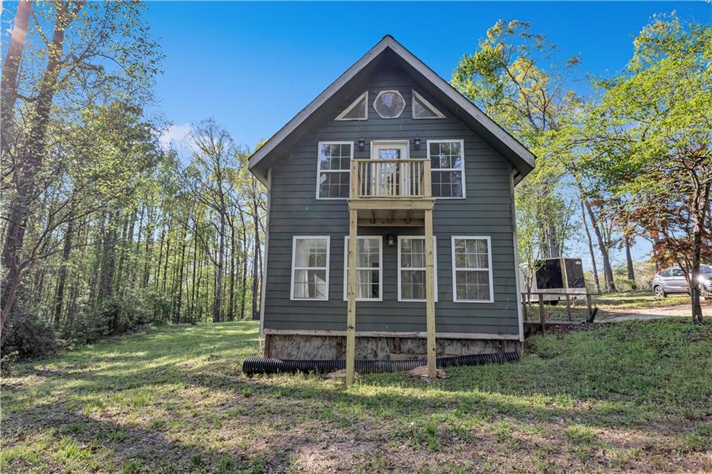 12005 A Hutchesons Ferry Road Palmetto, GA 30268 - Photo 4 of 53 front view of a house with a yard