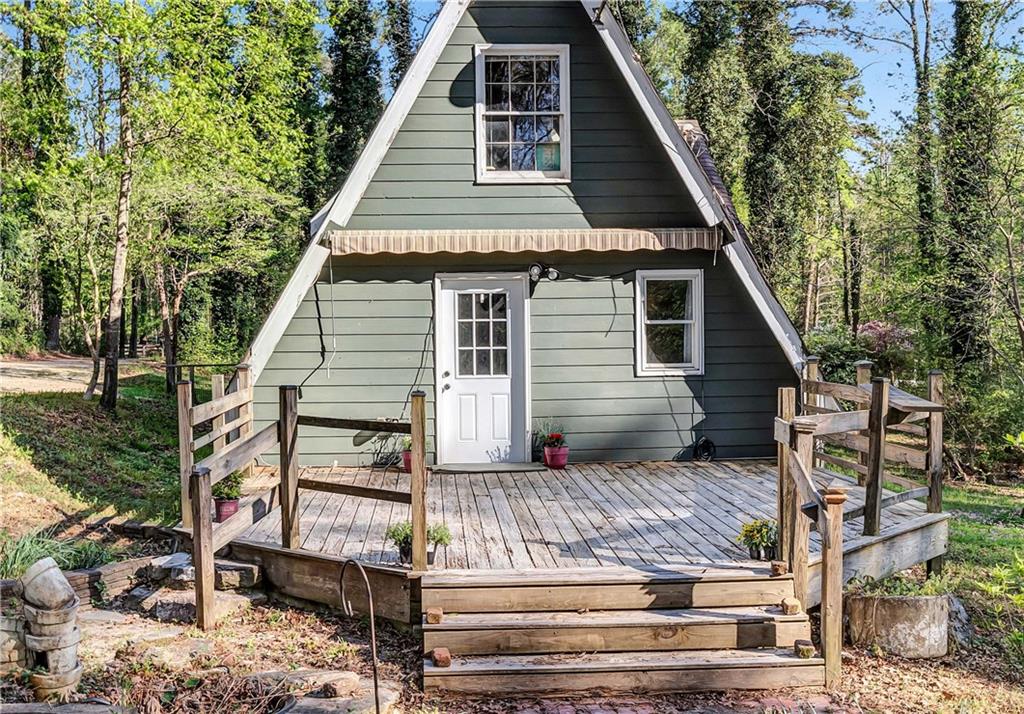 12005 A Hutchesons Ferry Road Palmetto, GA 30268 - Photo 45 of 53 a view of a house with a yard