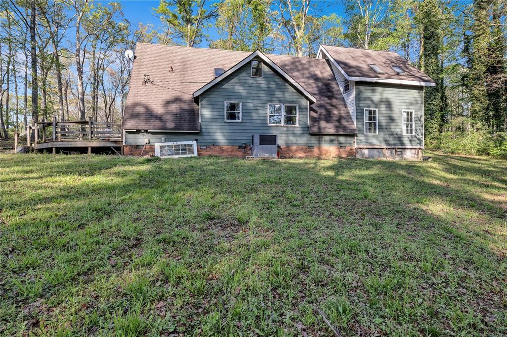 12005 A Hutchesons Ferry Road Palmetto, GA 30268 - Photo 5 of 53 a front view of house with yard and green space