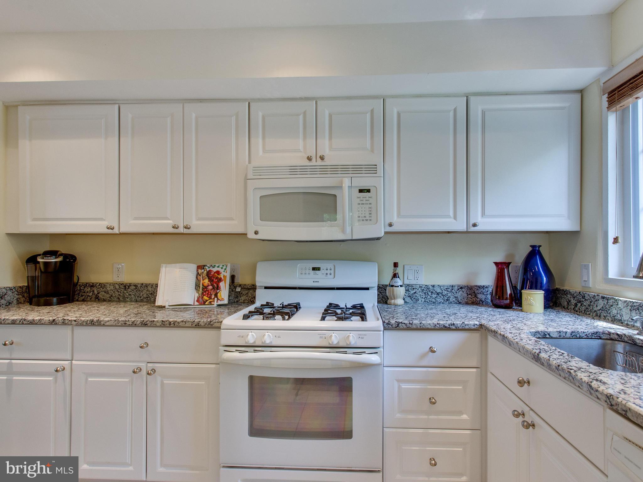 3753 Gunston Road Alexandria, VA 22302 - Photo 4 of 17 a kitchen with granite countertop white cabinets and white stainless steel appliances