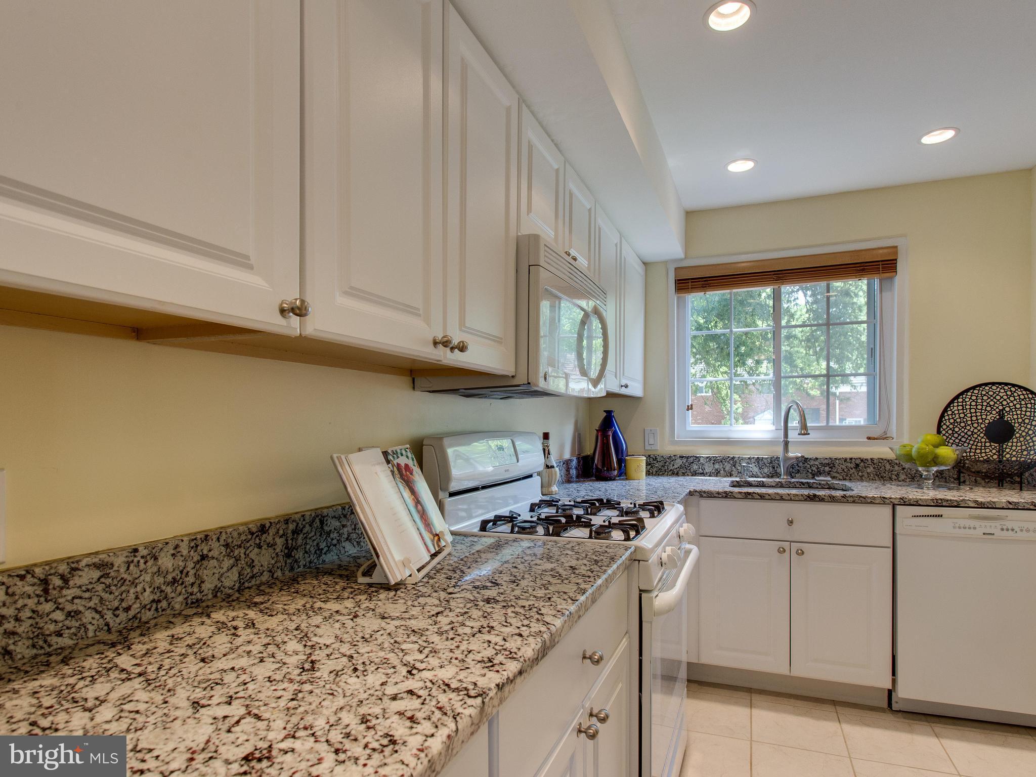 3753 Gunston Road Alexandria, VA 22302 - Photo 5 of 17 a kitchen with granite countertop a sink window and cabinets