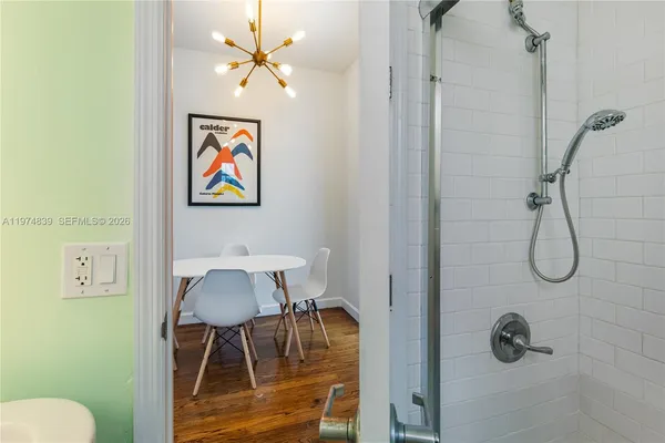 a bathroom with a granite countertop a sink and a toilet
