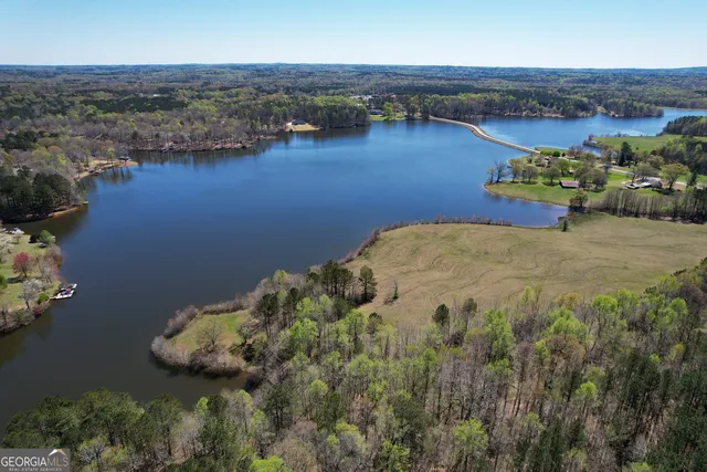 an aerial view of a house with a lake view