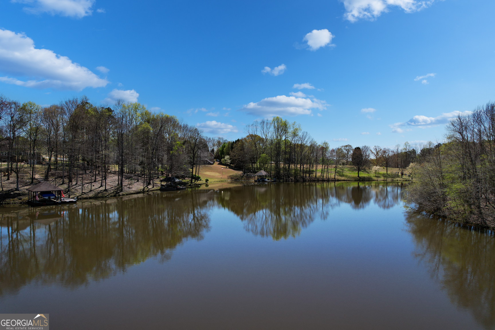0 Center Point Road, Unit TR 3 Carrollton, GA 30117 - Photo 3 of 11 a view of a lake with a building in the background