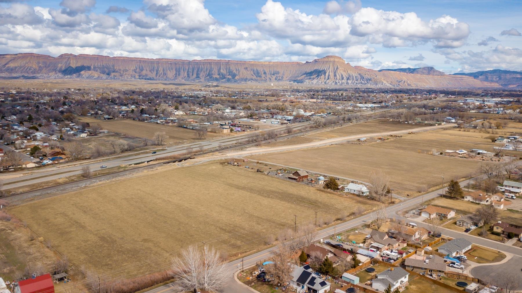 3062 E Road Grand Junction, CO 81504 - Photo 3 of 19 an aerial view of residential houses with outdoor space