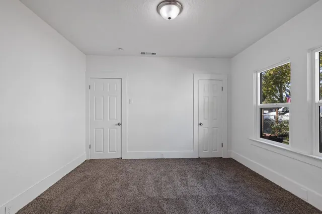 a kitchen with a sink cabinets and window