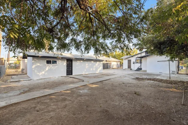 a view of a house with a yard and garage