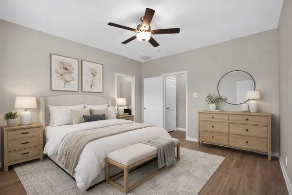 a bedroom with a bed and a dresser