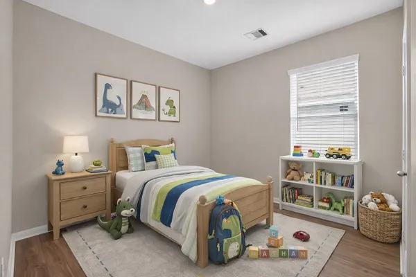 a bedroom with a bed and a window
