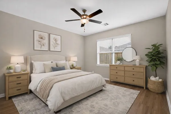 a bedroom with a bed and a dresser