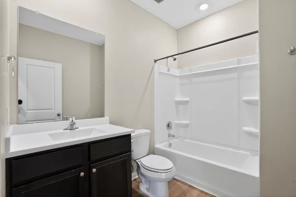 a bathroom with a sink a toilet and a bathtub