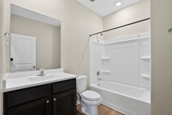 a bathroom with a sink a toilet and a bathtub