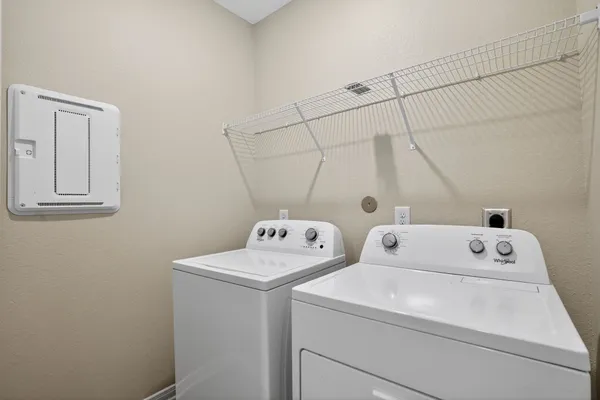 a utility room with dryer and washer