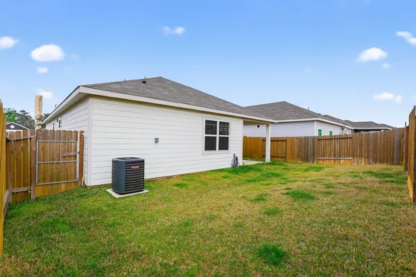 a view of a backyard with plants and a backyard
