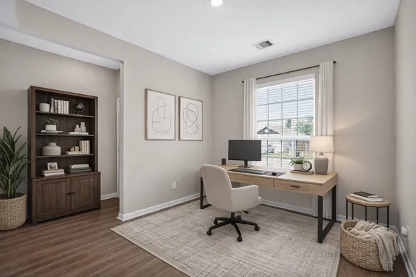 a workspace with furniture and window