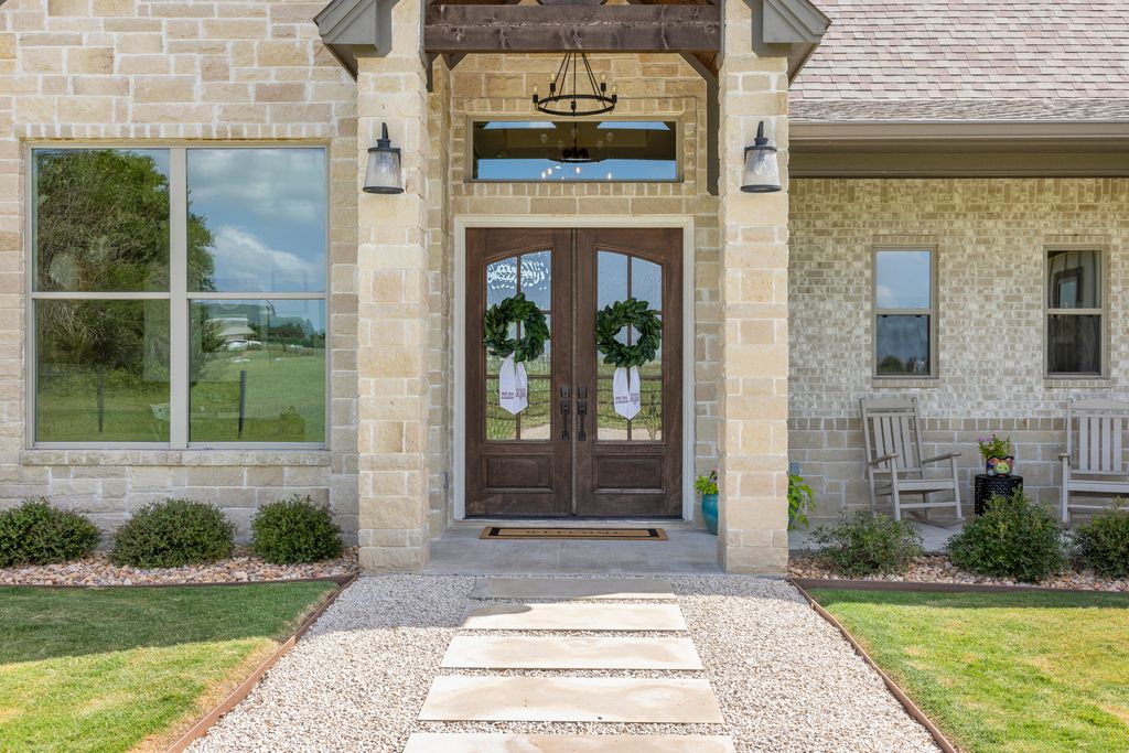 7650 Rolling Creek Road Burton, TX 77835 - Photo 20 of 22 a front view of a house with a yard