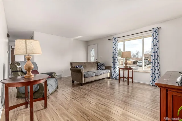 a living room with furniture and a table