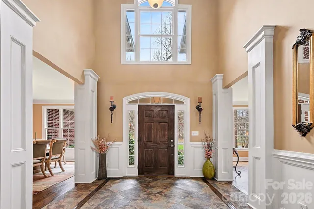 a front view of a house with outdoor seating