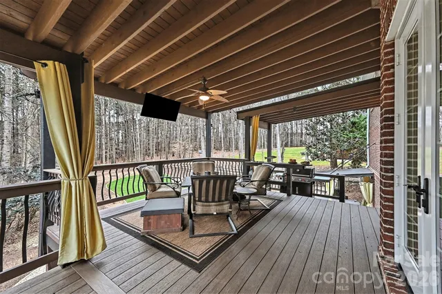 a view of a balcony with chairs
