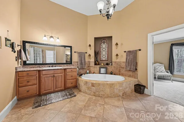 a large bathroom with a double vanity sink and a mirror