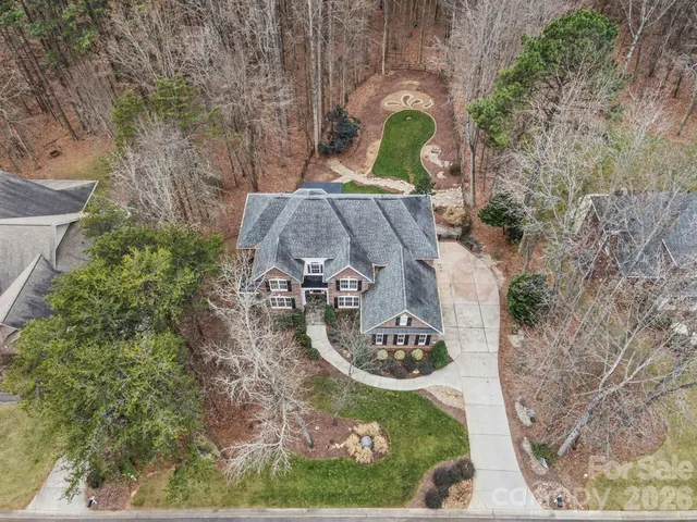 an aerial view of a house with outdoor space