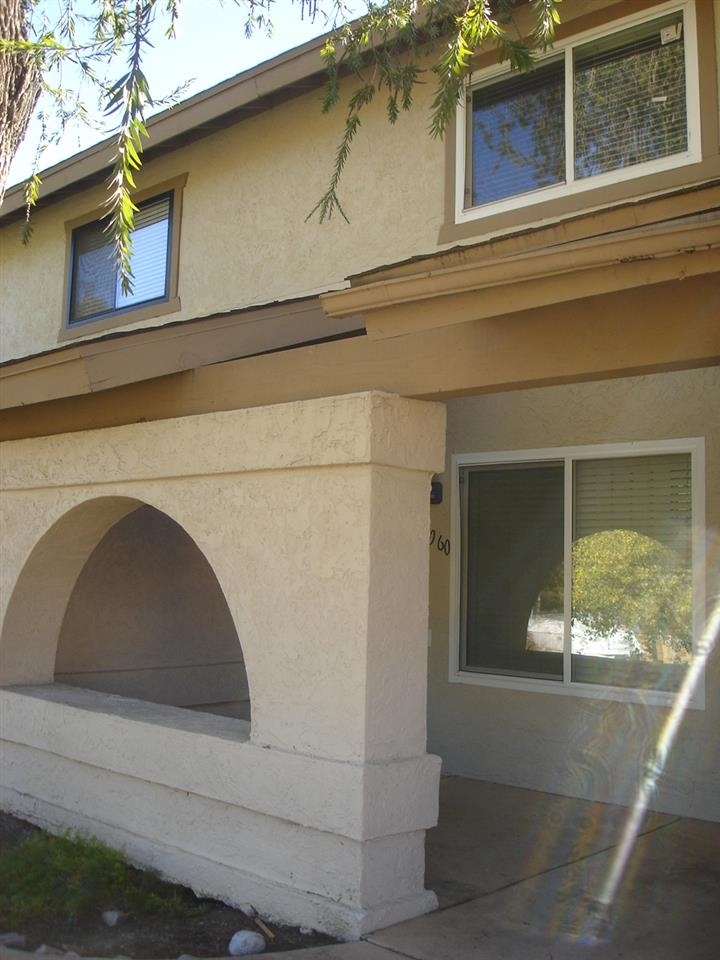 Exterior Front. Private Patio with Greenbelt views.