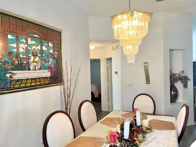 a close view of a chandelier and swimming pool in a bathroom
