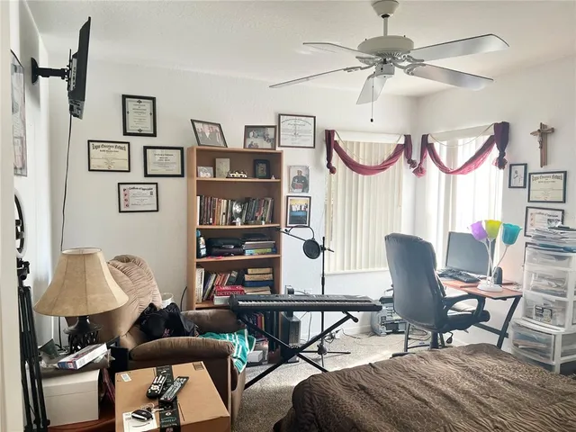 a living room with furniture a rug and a window