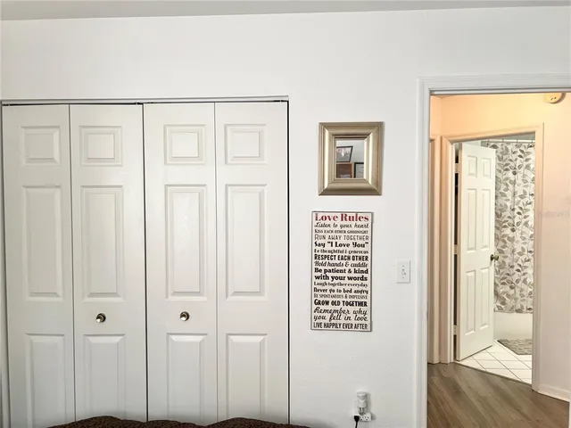 a view of an entryway with wooden floor