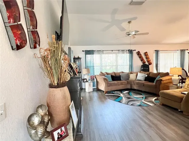 a living room with furniture and a window