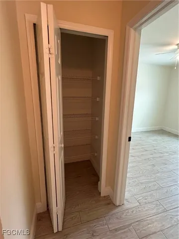 an empty room with wooden floor