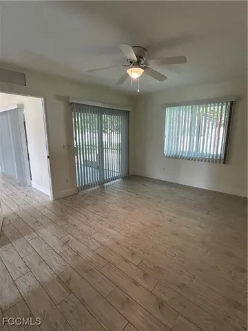 a view of an empty room with a window