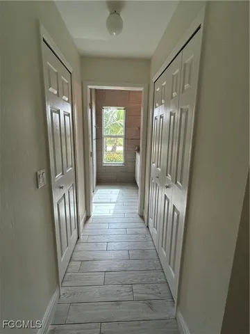 a view of a hallway with windows