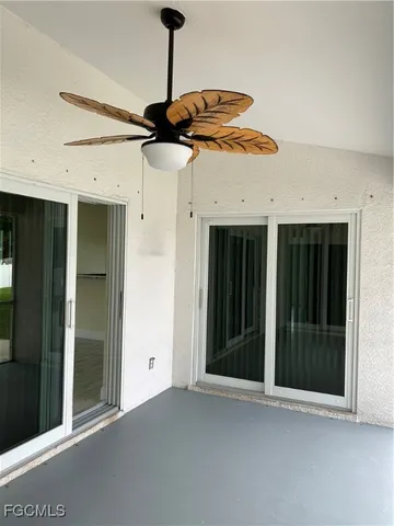 a view of an entryway with a ceiling fan