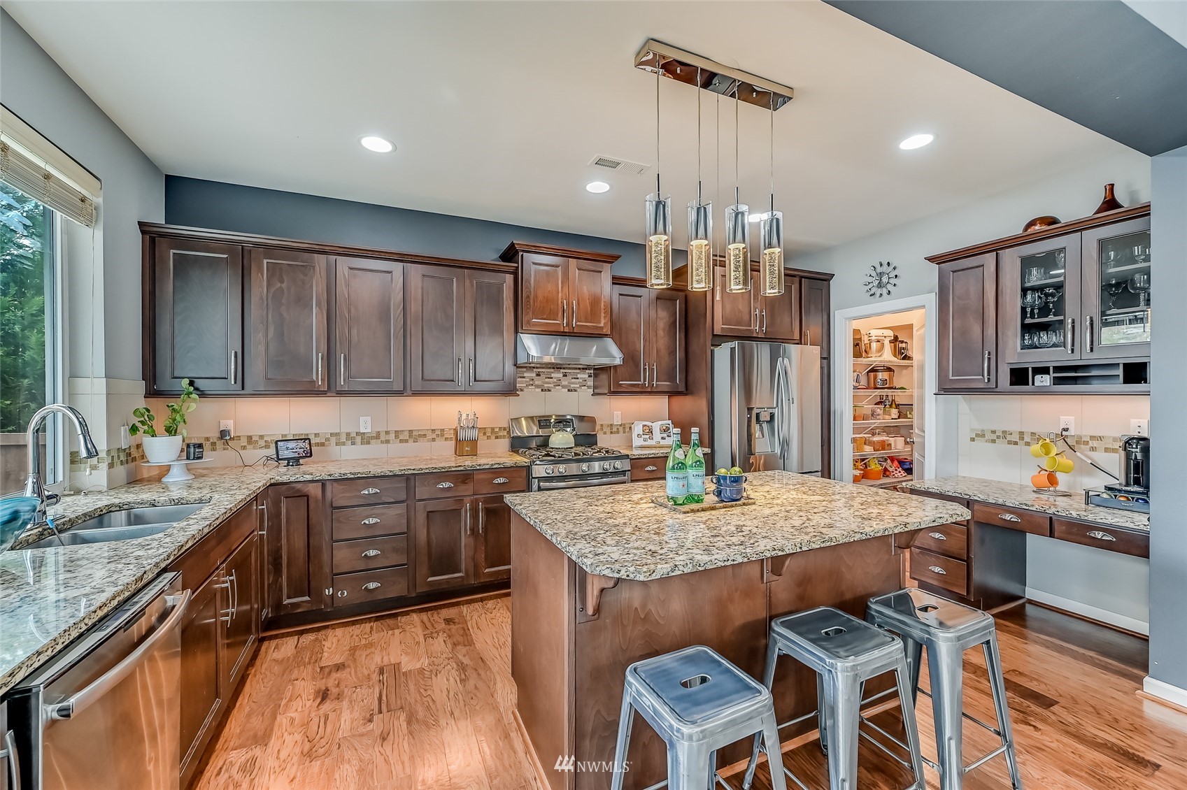 3715 195th Place Southeast Bothell, WA 98012 - Photo 11 of 28 a kitchen with granite countertop a sink stove and refrigerator